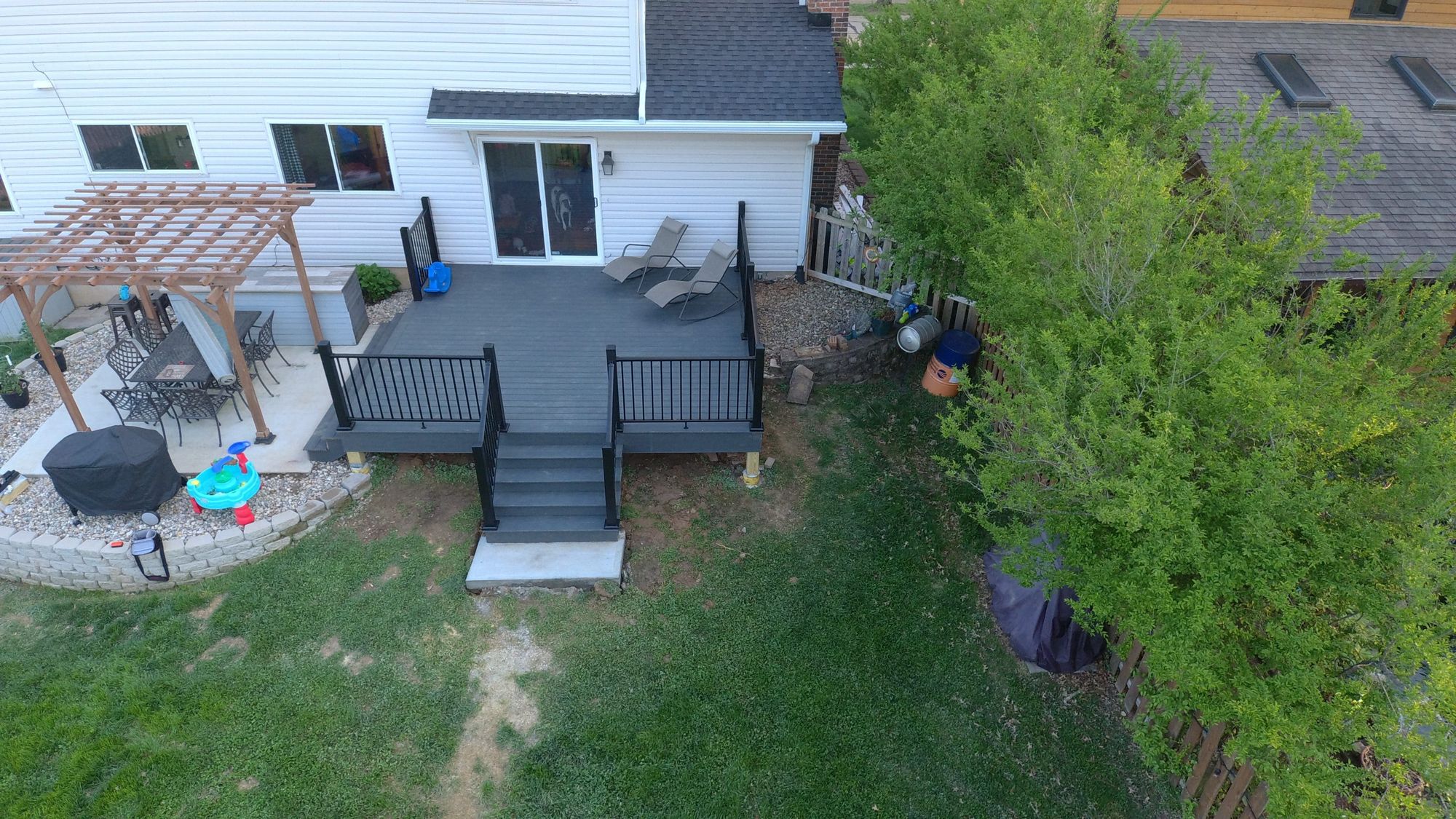 Gray deck with pergola seating area